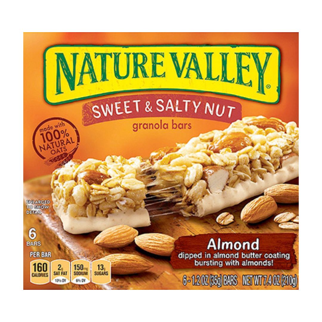 Nature Valley Sweet & Salty Nut granola bars packaging with almonds on a wooden board.